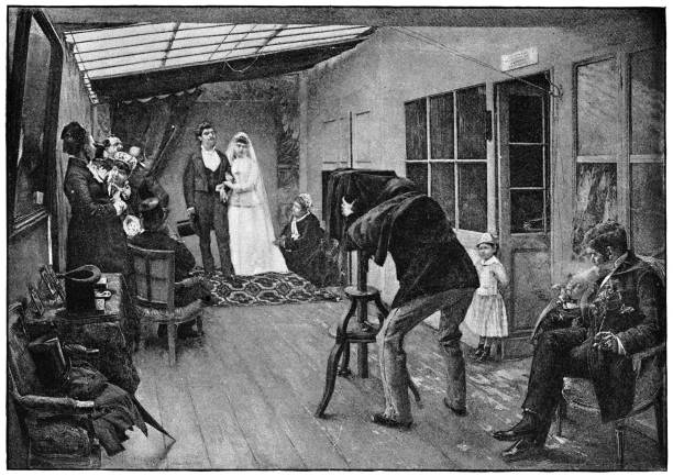 A Wedding Party at the Photographer by Pascal Dagnan-Bouveret - 19th Century A Wedding Party at the Photographer by Pascal-Adolphe-Jean Dagnan-Bouveret (circa 19th century). Vintage etching circa late 19th century. black and white portrait photographers stock illustrations