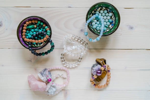 istock High angle view on crystal perls stones and bracelet on wooden table 1158301616