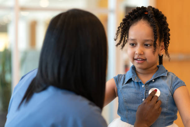 istock Little girl has heart checked at a routine medical check-up 1158304473