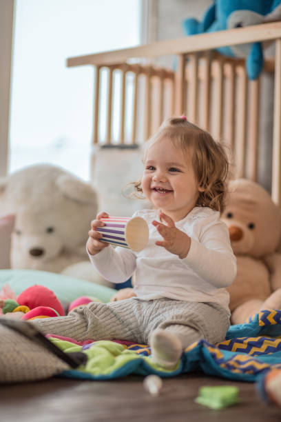 istock Joyful baby girl playing 1158304698
