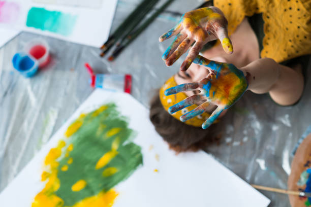 istock fun leisure artist floor hands colorful paint 1158304947