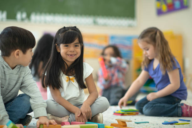 istock Multi-ethnic preschool girl smiles into the camera 1158305207