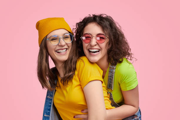 istock Laughing lesbian couple looking at camera 1158305289