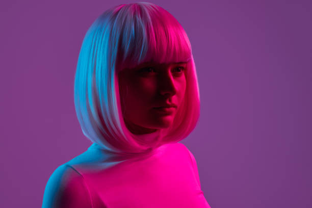 istock Futuristic woman under neon light 1158305332