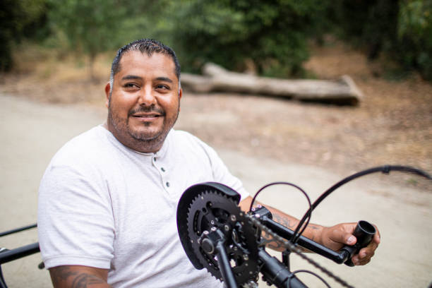 istock Mature Hispanic Man Riding Handcycle 1158306578