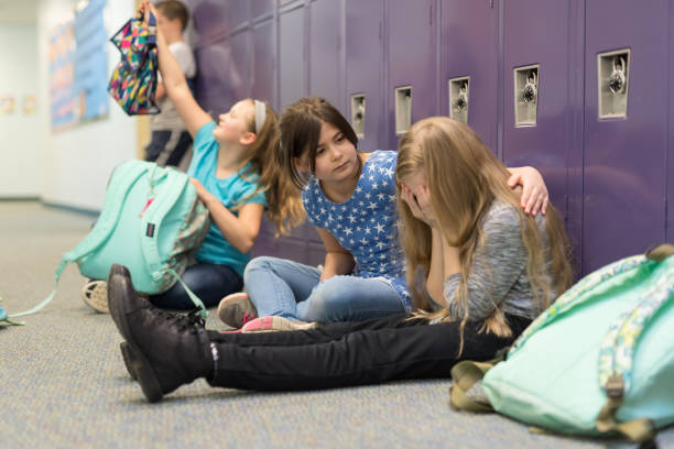 istock A friend consoling her friend at an elementary school 1158306763