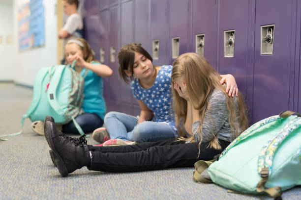 istock A friend consoling her friend at an elementary school 1158306766
