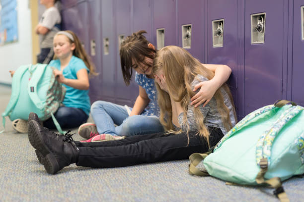 istock A friend consoling her friend at an elementary school 1158306768