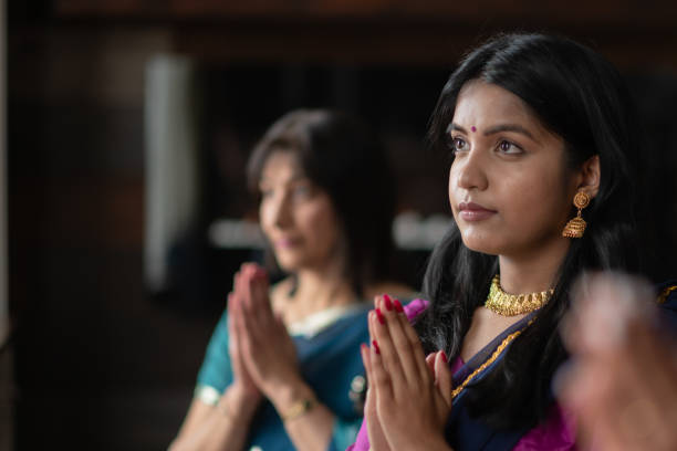 istock Praying Indian Family 1158306837