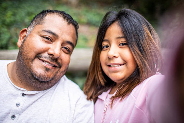 istock Mature Hispanic Man Taking Selfie with his daughter 1158306946