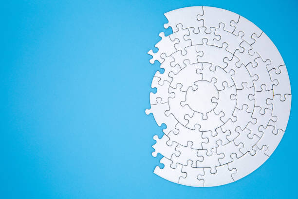 istock white jigsaw puzzle pieces on blue background,  Copy space. 1158309670