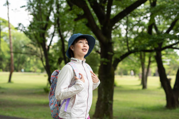 istock Woman hiking in tree area 1158309767