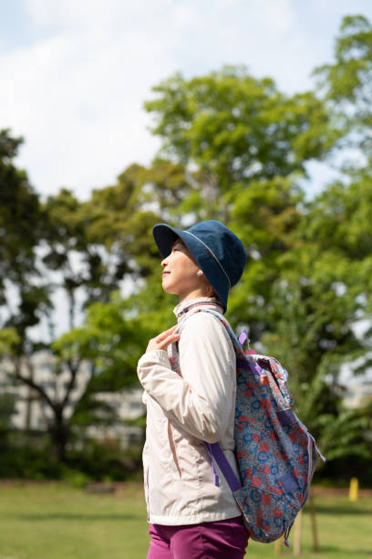 istock Woman hiking in tree area 1158309846