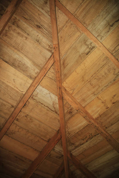 istock Beams and wooden structure of a roof 1158310638