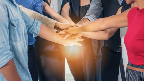 business people stacking hands together to cheer up team spirit business people stacking hands together to cheer up team spirit to success stacked hands photos stock pictures, royalty-free photos & images