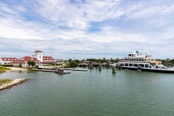 Ferry Port in Ocracoke Harbor The ferry dock and entrance to the harbor on Ocracoke island, North Carolina. ocracoke island stock pictures, royalty-free photos & images