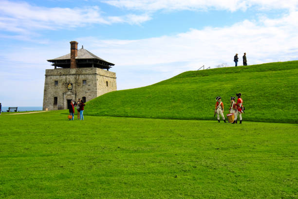 New York Buffalo Fort Niagara and French canon Buffalo NY USA - May 14, 2019 : Taken this picture of the Niagara fort in Buffalo USA. In the picture is the french soldiers dressed in foreground and the main building in background. There are tourists in background who are walking around. youngstown stock pictures, royalty-free photos & images