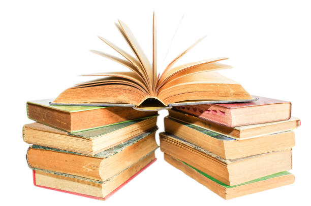 istock Old books stacked and isolated on white background 1158321969