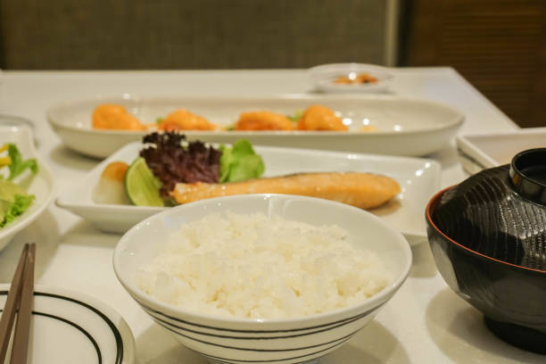 istock selective focus on white Japanese rice with grilled salmon for lunch in restaurant 1158327715