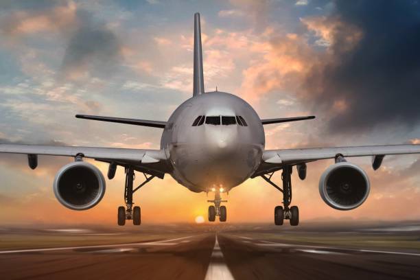 istock Airplane landing on airport runways during sunset 1158328482