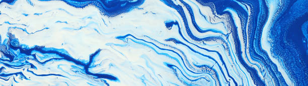 istock photography of abstract marbleized effect background. Blue and white creative colors. Beautiful paint. banner 1158329379