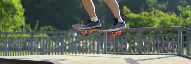 istock Skateboarder skateboarding on skate park 1158330334