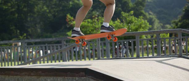 istock Skateboarder skateboarding on skate park 1158331964