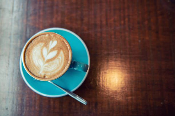 istock Hot Coffee Latte Art on the Wooden Table 1158332070