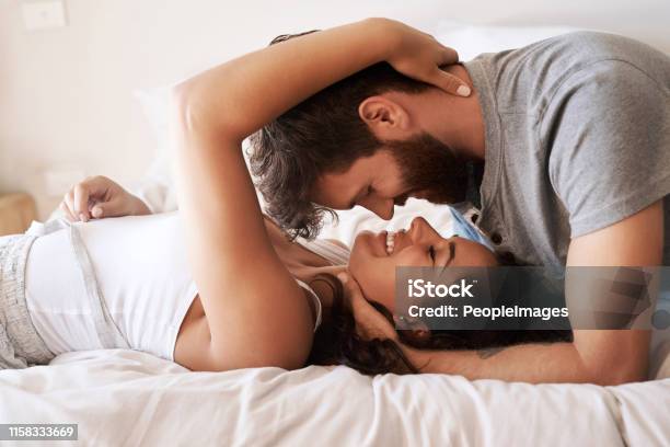 Nothing Enriches Life Like Love Stock Photo - Download Image Now - Couple - Relationship, Love - Emotion, Bed - Furniture
