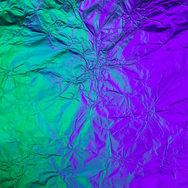 Purple green crumpled background made of illuminated foil. Trendy duotone texture Purple green crumpled background made of illuminated foil. Trendy duotone texture. flicker bird stock pictures, royalty-free photos & images