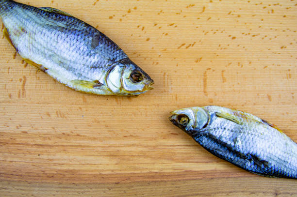 istock Dried roach fish on a wooden cutting board 1158343217