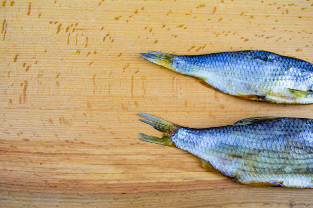 istock Dried roach fish on a wooden cutting board 1158343231