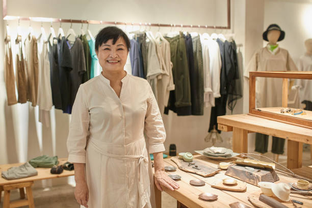 istock Active Senior Taiwanese Woman Working in Gift Shop 1158344714