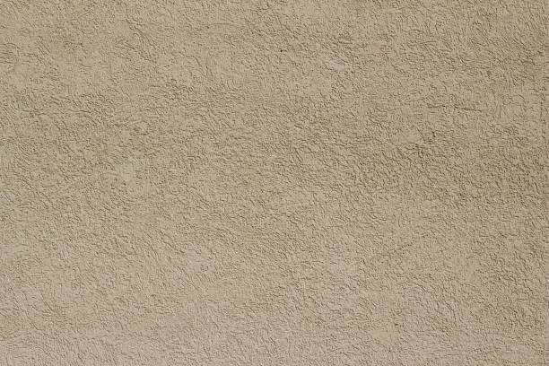 istock Close-up view of a vintage white stucco wall textured background 1158347552