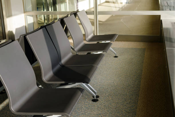istock Empty seat at the airport terminal. waiting area for boarding 1158348341