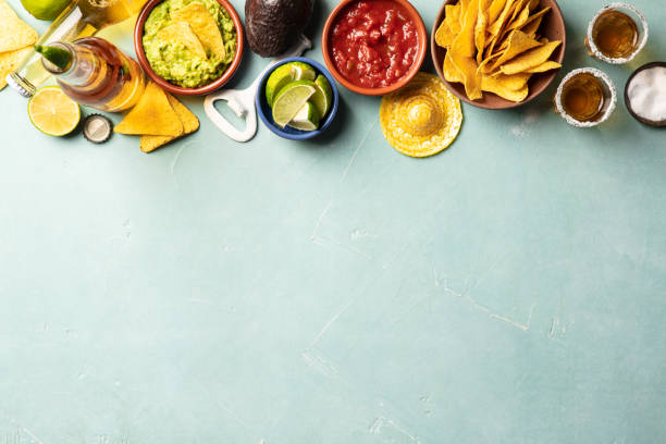 nachos, guacamole, salsa and beer and tequila on blue background - 4609 imagens e fotografias de stock