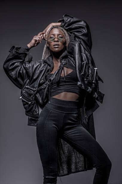 istock Beautiful Black dreadlocked Woman in Studio Setting 1158359156
