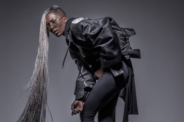 istock Beautiful Black dreadlocked Woman in Studio Setting 1158359172