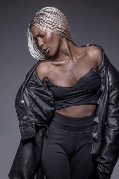 istock Beautiful Black dreadlocked Woman in Studio Setting 1158359475