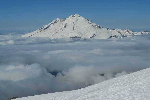 Mount Baker Sea of Clouds from Sulphide Glacier, Summit Pyramid of Mount Shuksan, Washington USA. cascade range north cascades national park mt baker mt shuksan stock pictures, royalty-free photos & images