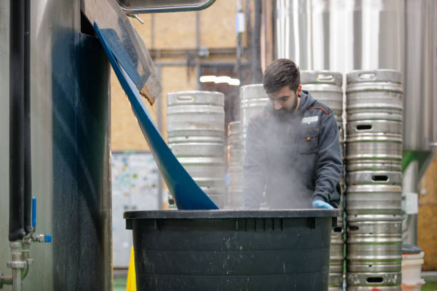 istock Standing by the barrel and blending hop by hand 1158360552