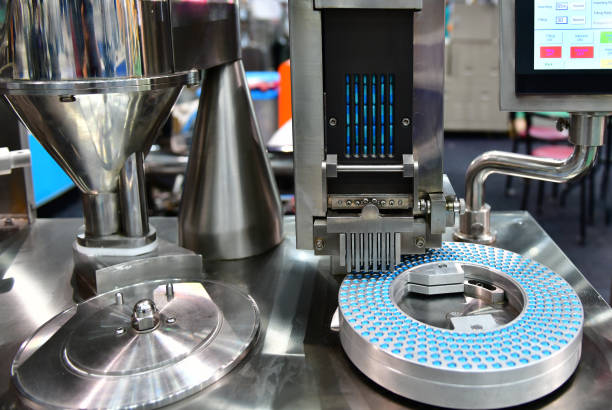 istock Blue capsule medicine pill production line 1158361657
