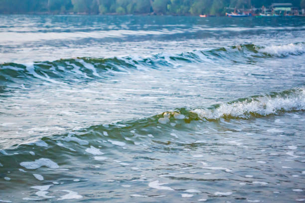 White sea wave splash water. Pacific Ocean with blue color. Purple and pink  water wave abstract pure natural texture, gel soap, background. Surface of water.