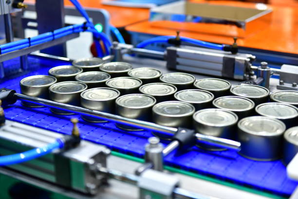 istock Canned food products on conveyor belt for transportation system 1158366335