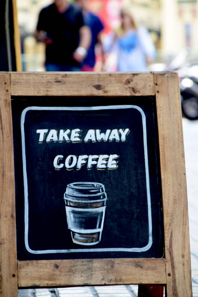 istock Take away coffee written on sidewalk sandwich board 1158376972