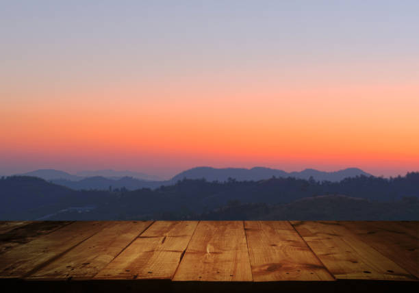 istock wooden table with Morning sunrise 1158381090