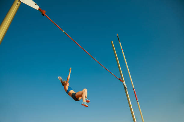 istock Female high jumper training at the stadium in sunny day 1158384485