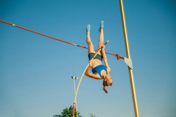 istock Female high jumper training at the stadium in sunny day 1158384496