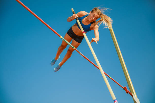 istock Female high jumper training at the stadium in sunny day 1158384497