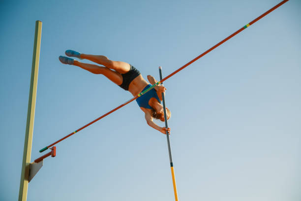 istock Female high jumper training at the stadium in sunny day 1158384501